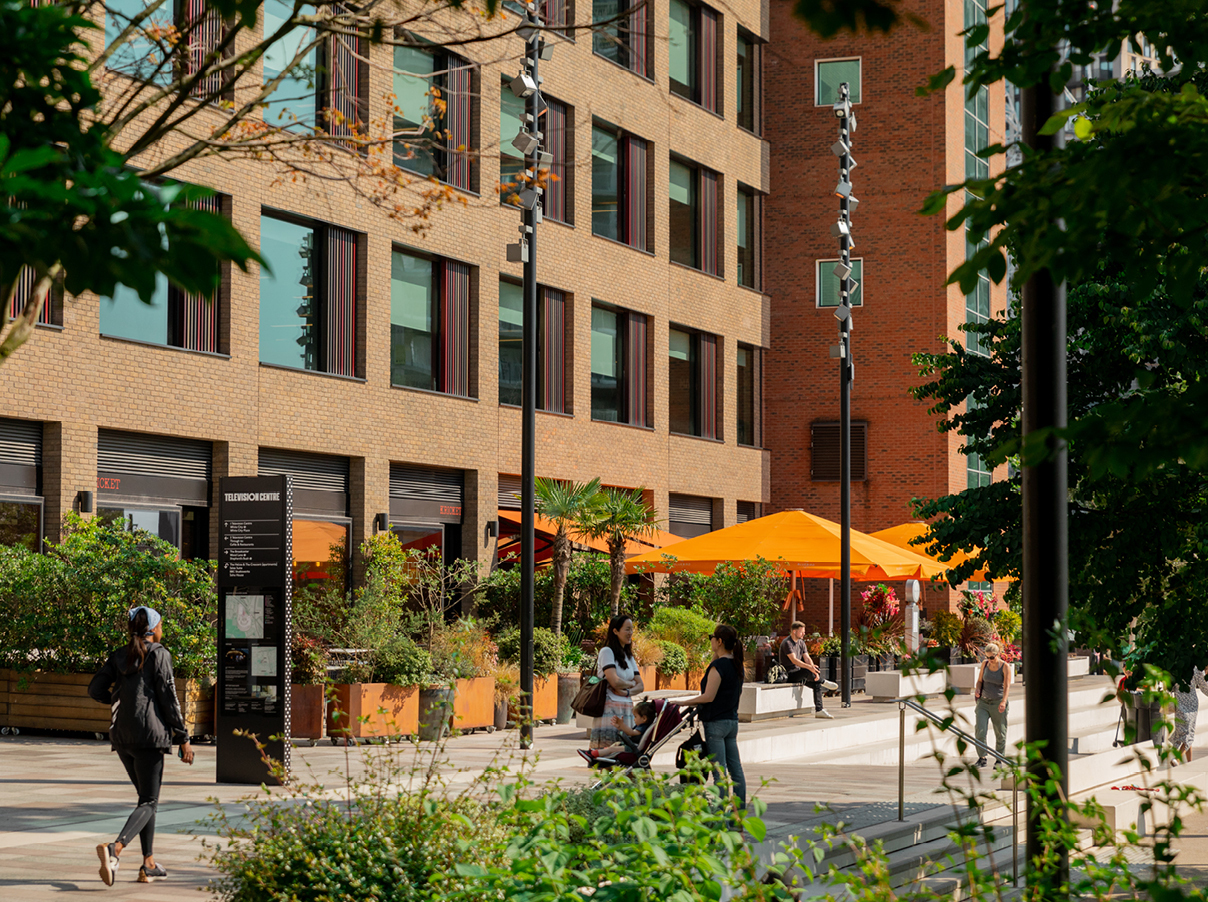 Busy, vibrant street scene outside of One Wood Crescent